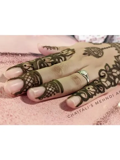 Another angle of the elegant floral vine design, showing how it gracefully covers the side of the hand and fingers.