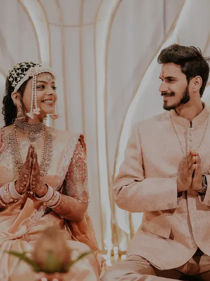 A traditional moment from the engagement ceremony. The bride's floral mundavalya, made of delicate white flowers, looks so elegant.