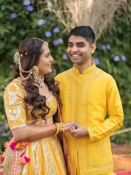 Another sweet moment between the couple. Her Haldi look is fresh, youthful, and full of joy.