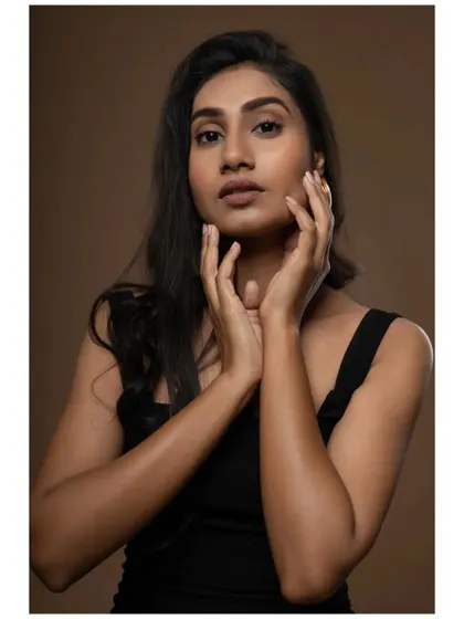 A beauty shot from the same portfolio, with hands framing the face. This pose is often used in skincare and makeup campaigns, making it a valuable addition to a model's book.