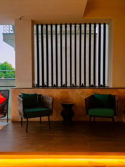 Another view of the seating area, showing how the slatted screens provide privacy while still allowing light and air to filter through.