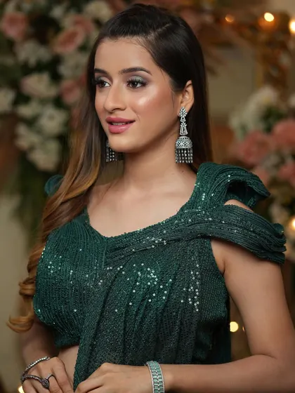A touch of mystic and a drizzle of pixie dust. This glamorous look with a silver-toned smokey eye and pink lips is perfect for a cocktail party or reception.