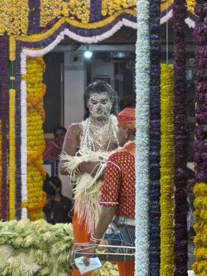 A 'patri' possessed by the Naga daiva during a Nagamandala ritual, his face smeared with the intoxicating 'hombale' flower. This is a raw, powerful form of worship that I document.