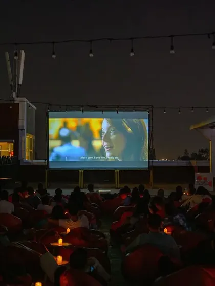The screen is lit, the audience is settled, and the movie is about to begin. A typical night at our 1 MG Lido Mall rooftop cinema in Bangalore.