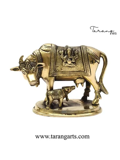 A symbol of prosperity and nurturing, our brass cow and calf statue is a beloved addition to any home. This piece features a small depiction of a deity on the saddle, enhancing its sacredness and making it an ideal Vastu or gifting item.