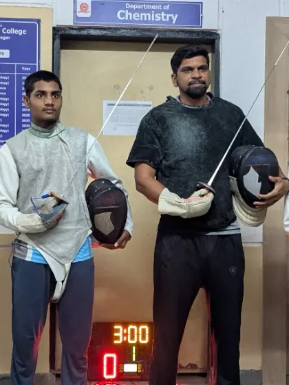 Our fencers holding their foils and masks, ready for the challenge ahead. We ensure our athletes are not just physically prepared, but also mentally equipped for major tournaments.