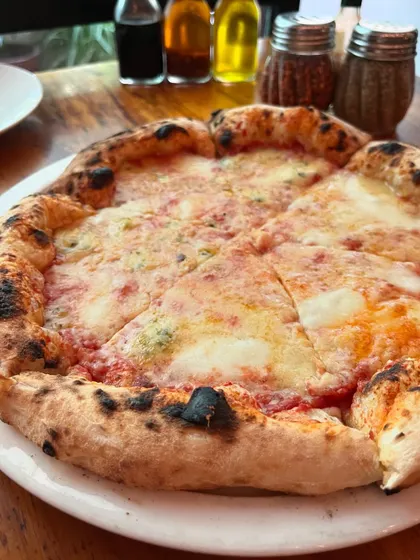 A slice of heaven for every cheese lover: our Quattro Formaggi pizza.