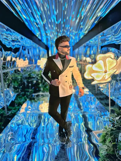 A black and white split blazer for a Sangeet night with a futuristic theme.