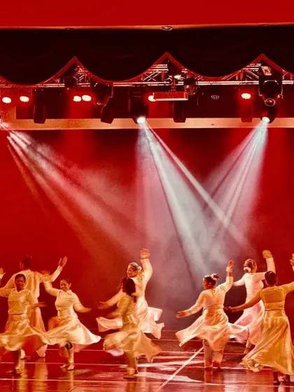 Students in a beautiful formation under the dramatic red stage lights at Manch 24. I focus on creating visually stunning moments that make the performance unforgettable for both the dancers and the audience.