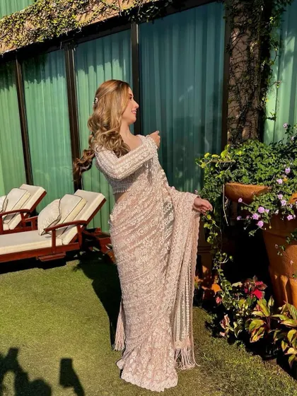 A beautiful shot of my client enjoying the golden hour. Her soft, sun-kissed waves were styled for a natural yet glamorous look, perfect for a bridesmaid or sister of the groom.