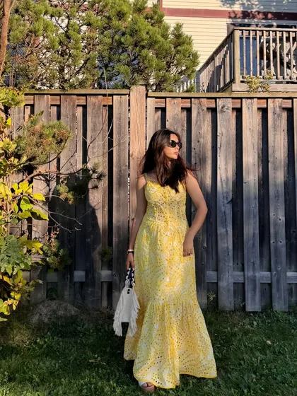 A full-length shot of the Jardinvue summer dress, showing how it moves in the gentle breeze.