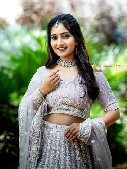 A portrait shot focusing on the upper half of the lavender lehenga and the matching jewelry.