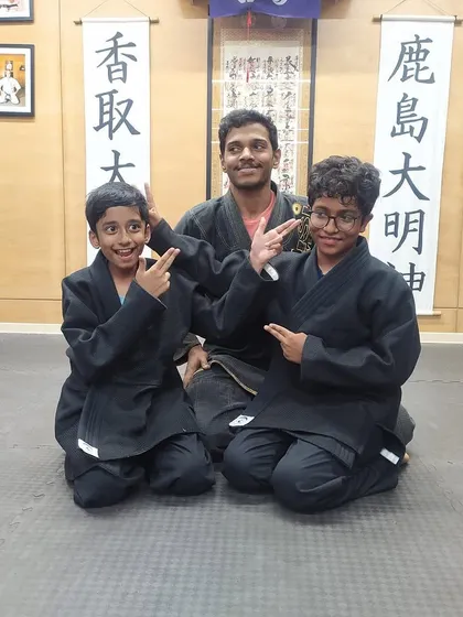 Fun and focus go hand in hand. Our instructor with two of our young warriors after a great class. We aim to make learning martial arts an enjoyable and empowering experience.