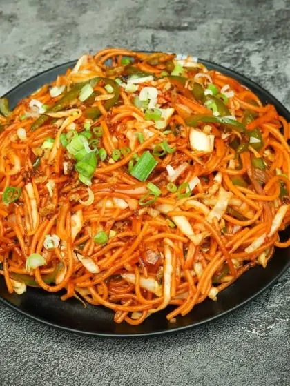 A hearty plate of my homestyle vegetable chowmein, loaded with fresh veggies and tossed in a savoury sauce.