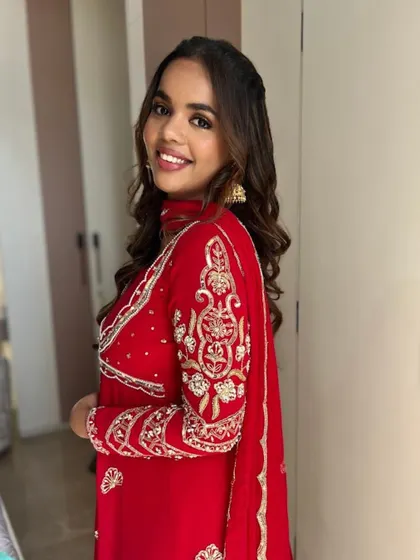 A beautiful smiling shot that shows how this simple glam look enhances her natural beauty. It's perfect for any festive occasion.