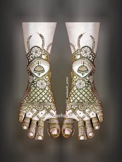 A very detailed and traditional bridal foot design. It features jhumkas, jaali work, and floral elements for a complete look.