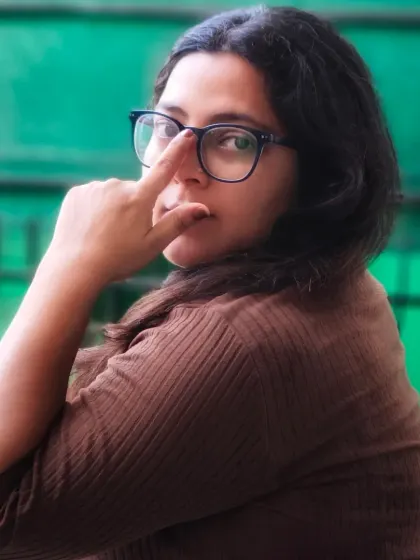 A playful self-portrait adjusting my glasses. I believe in showing all sides of my personality, and that includes the everyday, simple gestures.