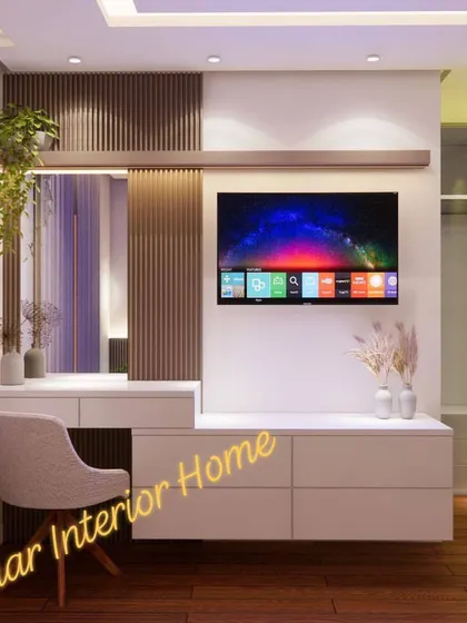 A bedroom TV and dressing table combination, with a fluted wood panel and a floating white console.