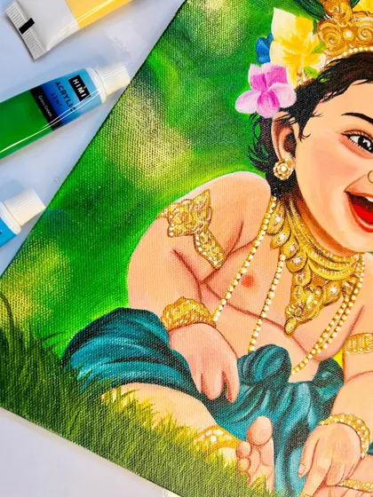 A close-up of my Bal Krishna painting, focusing on his joyful expression. I used acrylic paints to capture the vibrant green background and the intricate details of his jewelry.