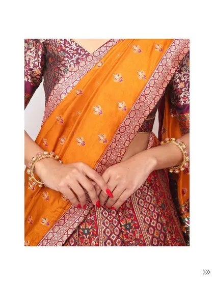 A detail shot of the brocade lehenga, highlighting the beautiful weave of the blouse and the contrasting texture of the silk dupatta.