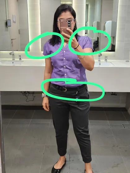 During a fitting, we analyze every detail. Here, I've circled areas to show how a different sleeve cut and a proper tuck can completely change the silhouette.