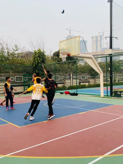 A player elevates for a layup, showing great athleticism.