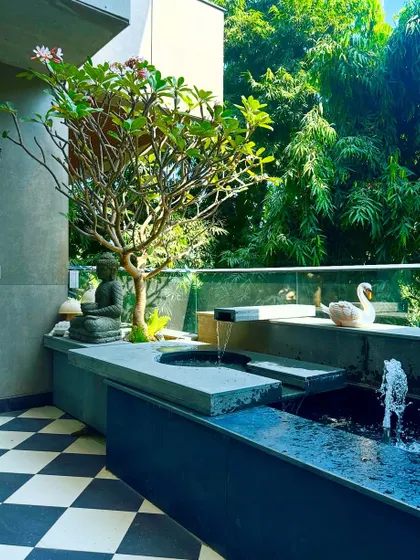 The water gently cascades in this balcony feature, creating a soothing sound that masks city noise and enhances the feeling of tranquility.
