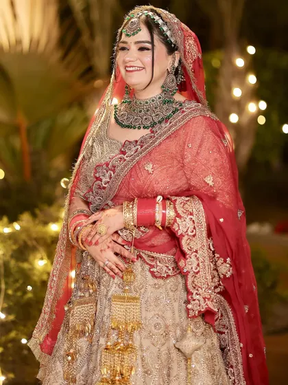 A joyful, candid shot of the bride. Her smile shows how comfortable and confident she feels in her complete bridal look.