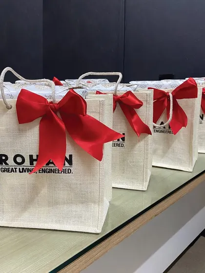 Classic customized jute bag hampers for Rohan Builders. These eco-friendly and stylish bags are perfect for real estate client gifting, combining aesthetics with thoughtfulness.