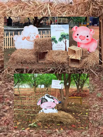 Adorable animal cutouts, including a pig and a cow, are placed among hay bales, creating a fun and welcoming entrance to the farm-themed celebration.