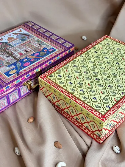 Two of my exquisite dry fruit hamper boxes, showcasing the variety in traditional Rajasthani and Mughal art-inspired designs. These are crafted to impress.