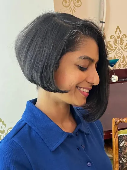 The asymmetry adds a modern touch to the classic bob.