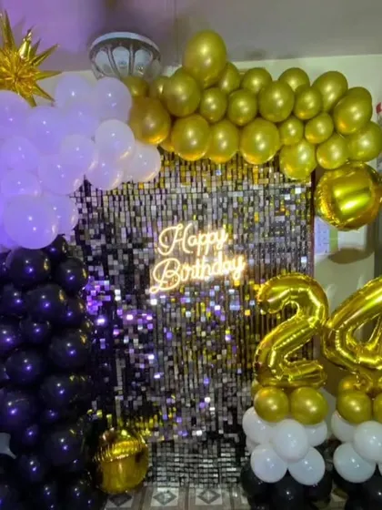A variation of the 24th birthday shimmer wall decor, this time with white and gold balloons for a different look.