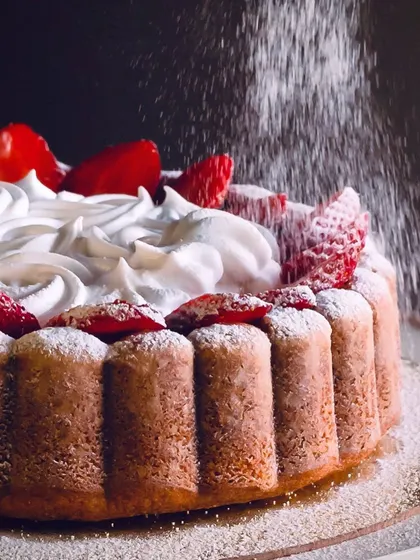A strawberry-topped bundt from our seasonal bakes... the food photograph is credited to @johnciecorreia.photography.
