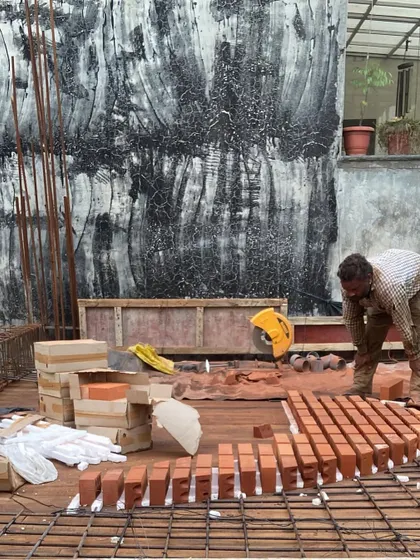 Work underway on the brick infill slab. This hands-on process requires precision and skill to ensure the final result is both structurally sound and aesthetically pleasing.