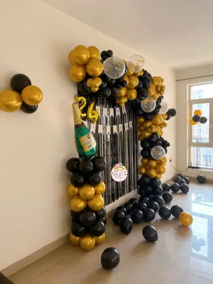 A full view of the black and gold 24th birthday balloon arch, perfect for creating a grand entrance or photo corner.