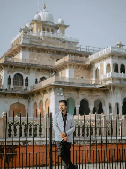 A stylish solo portrait of the groom, using the grand architecture of Albert Hall and its iron fence as a backdrop. It’s a strong, confident shot.