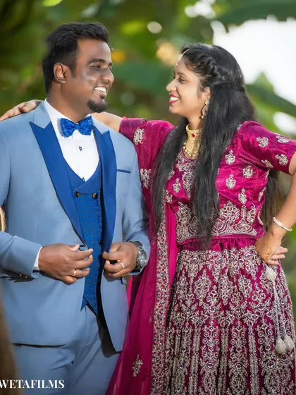 A joyful and relaxed pre-wedding portrait. The genuine laughter between the couple is what makes this photo special, reflecting a comfortable and fun photoshoot experience.