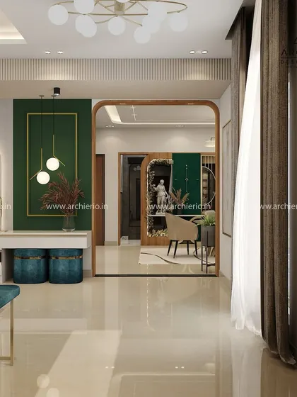 A dramatic entryway with a large mirror and a bold green accent wall. This space is designed to make a statement and sets a luxurious tone for the rest of the home.
