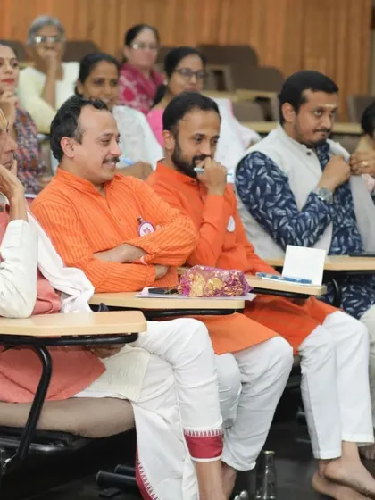 The audience and speakers at the "Pranamami Patanjali" event, a gathering of scholars and yoga enthusiasts.