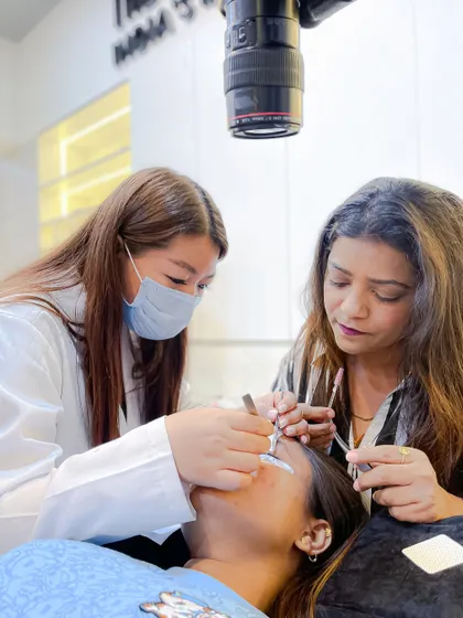 Close supervision ensures quality. Our instructor provides pointers to a student during a live model session, correcting form and technique on the spot.