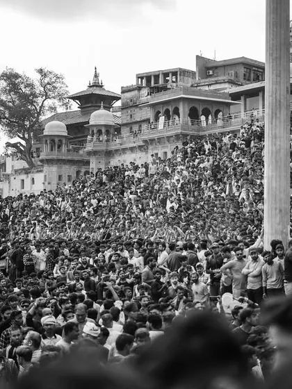 A black and white photo series from Masaan Holi. These images strip away color to focus on the raw emotion, the crowds, and the stark spiritual power of this unique festival.