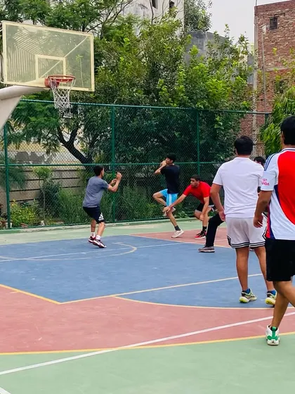 Players working on their offensive and defensive transitions in a full-court game.