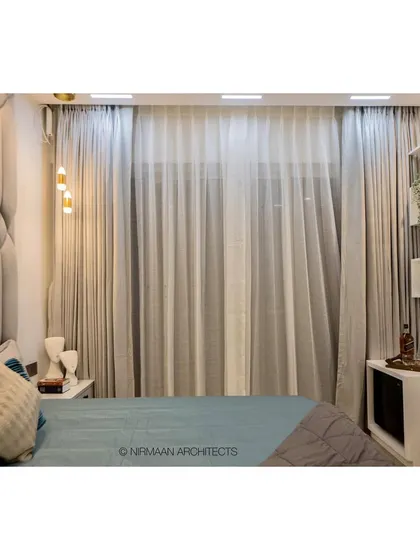 Another view of the smart master bedroom at Bhagwati Greens. The automated curtains and lighting can be controlled from the bedside, offering ultimate convenience and comfort.