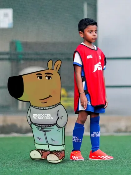 Just two chill guys. A young player poses with a cool capybara cartoon, showing the fun and relaxed side of our football community.