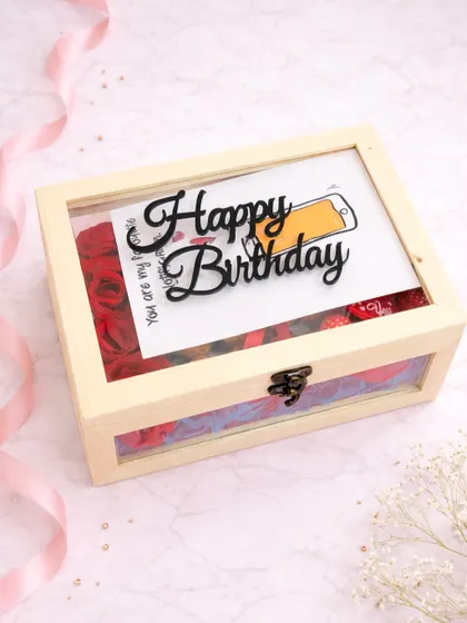 This wooden keepsake box has a clear lid to give a peek at the gifts inside. I added a "Happy Birthday" message on top of a cute card, surrounded by red roses.
