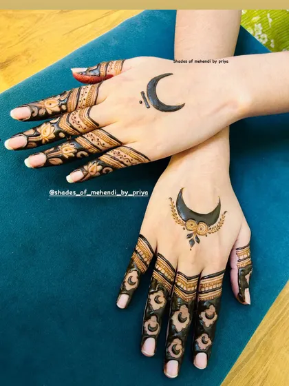 A chic and modern design featuring crescent moons. The mix of bold shapes and delicate finger details creates a very stylish look.