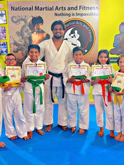 A group of our students with their new belts and certificates after successfully completing their Kyu and Geup tests.