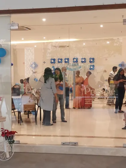 A view from outside the party hall, showing guests mingling and enjoying the celebration. We handle all the details so you and your guests can simply relax and have a great time.