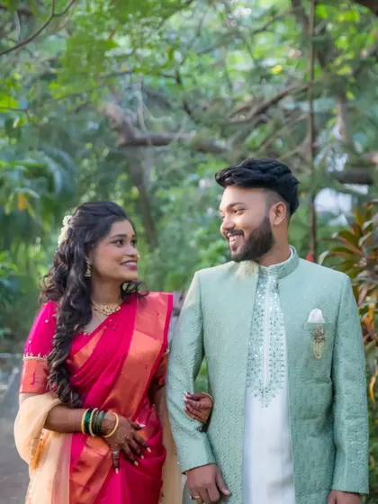 The couple takes a romantic stroll during their engagement photoshoot. These walking shots create a sense of movement and natural interaction.